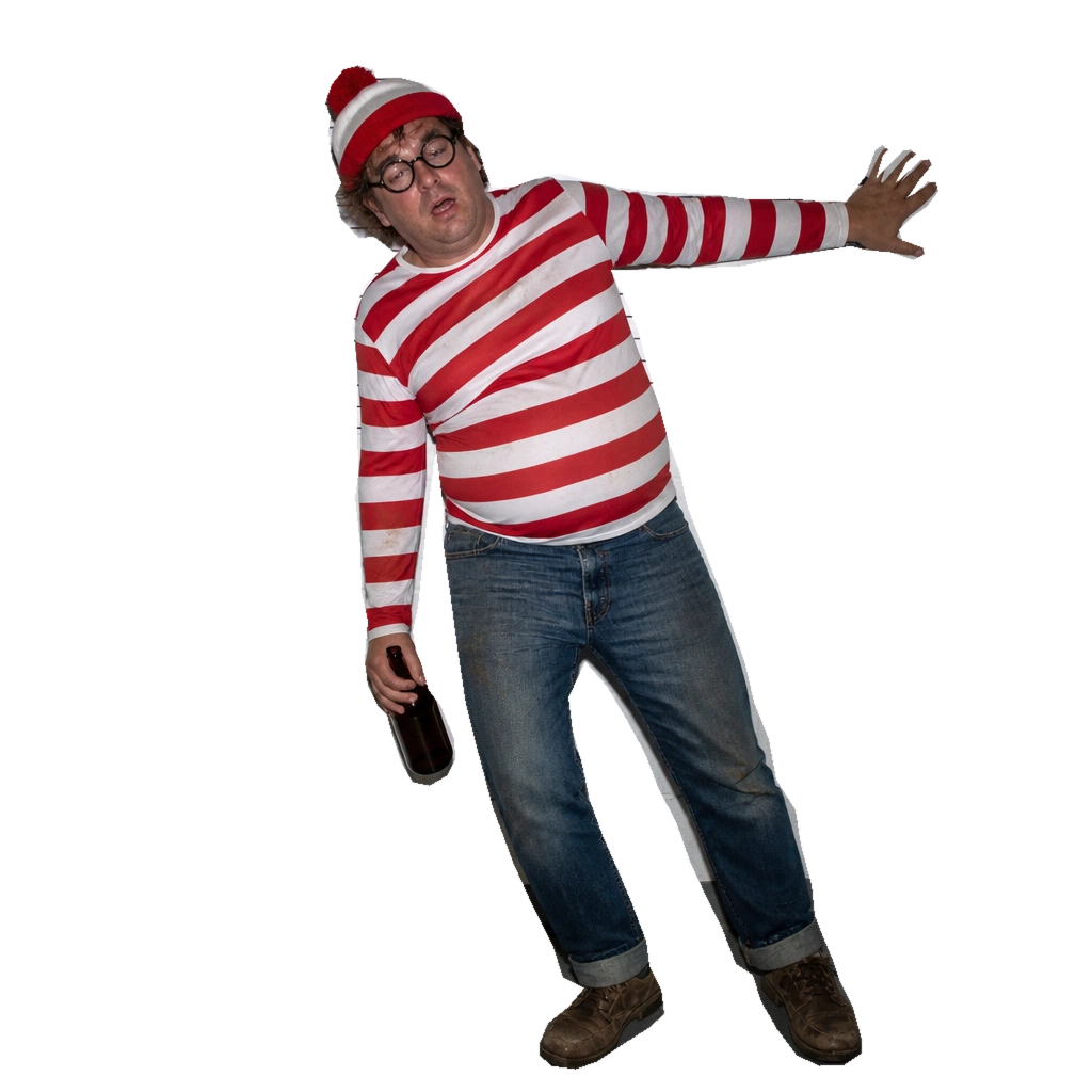 Drunk Waldo, glasses askew and red-and-white beanie on, leans sideways with one hand braced on the wall and a brown bottle in the other.